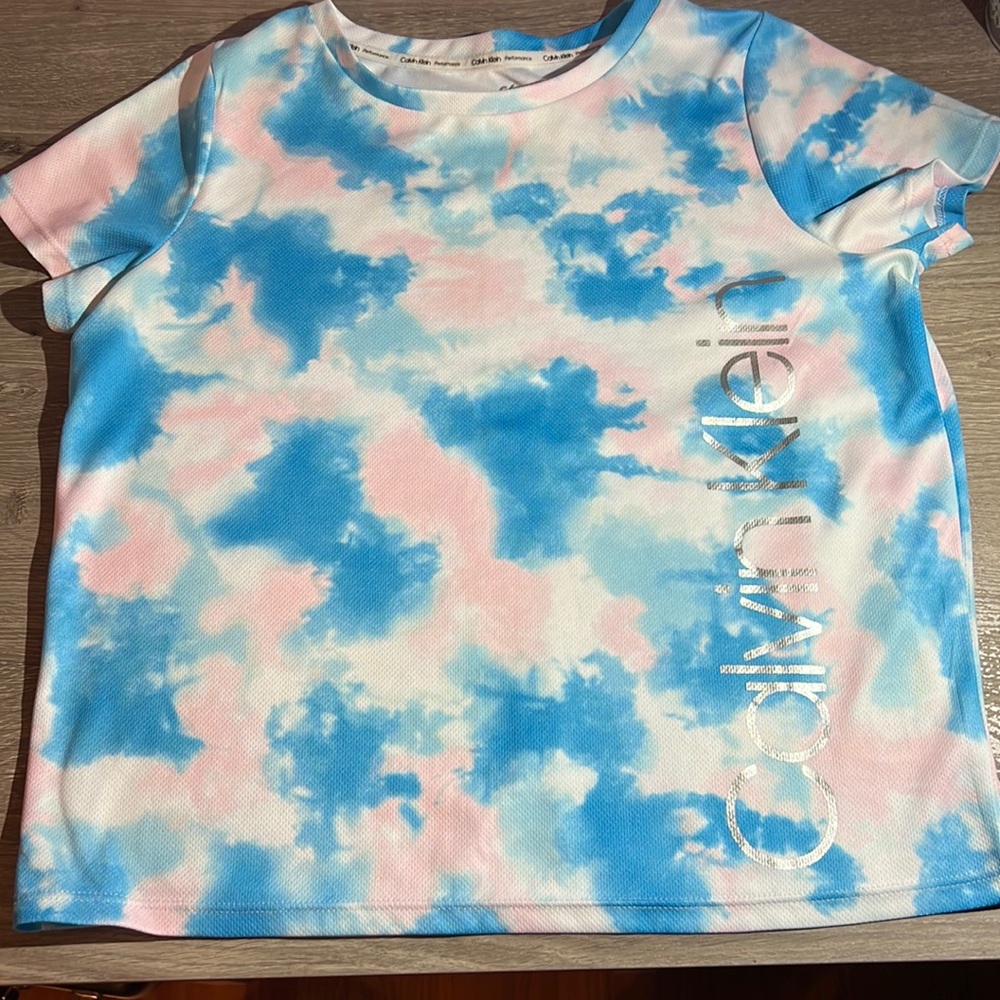 A girls L/G/G (10/12) blue and pink tie-dye Calvin Klein shirt.